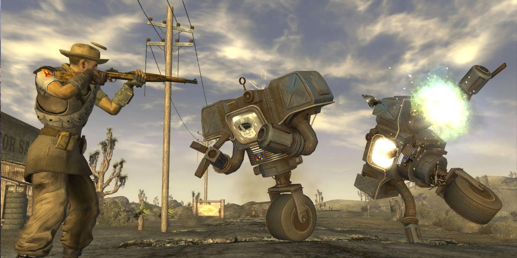 Nhân vật trong game RPG hậu tận thế Fallout New Vegas chĩa vũ khí vào các cỗ máy