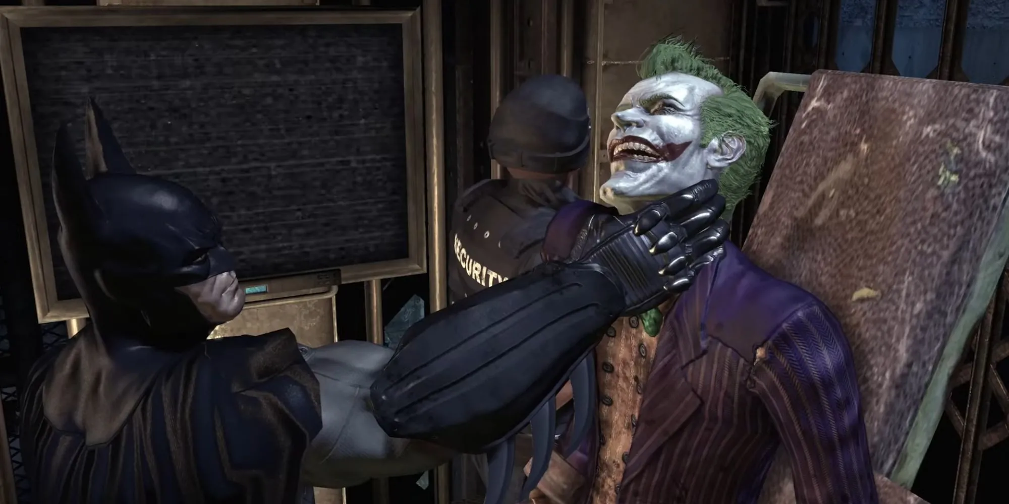 Batman giữ Joker ở cổ khi hắn bị vận chuyển đến phòng giam trong Batman Arkham Asylum