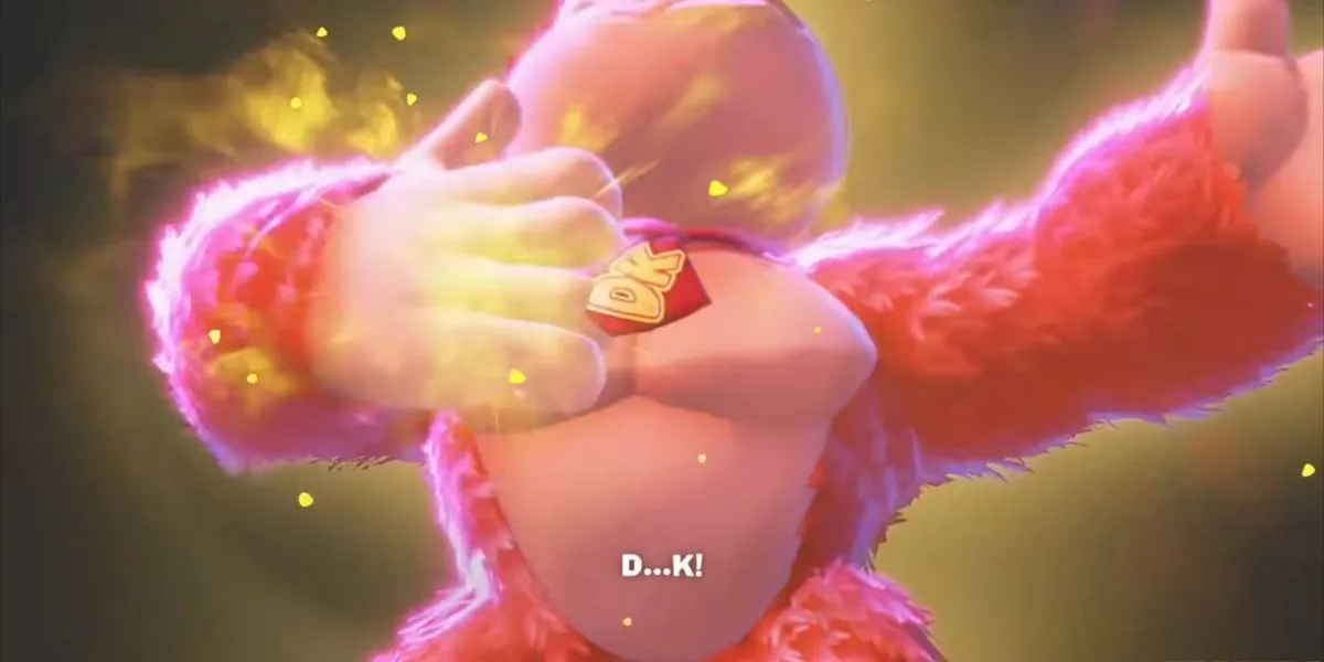 Donkey Kong đang vỗ ngực mạnh mẽ, xung quanh là ánh sáng tượng trưng cho năng lượng Bananergy, cho thấy đây là cử chỉ kích hoạt biến hình mạnh mẽ trong Donkey Kong Bananza.