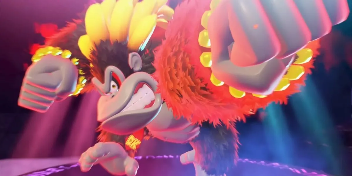 Donkey Kong trong hình thái Kong Bananza to lớn, cơ bắp cuồn cuộn đang đấm vỡ một khối đá lớn, minh họa sức mạnh vượt trội của biến hình này trong Donkey Kong Bananza.