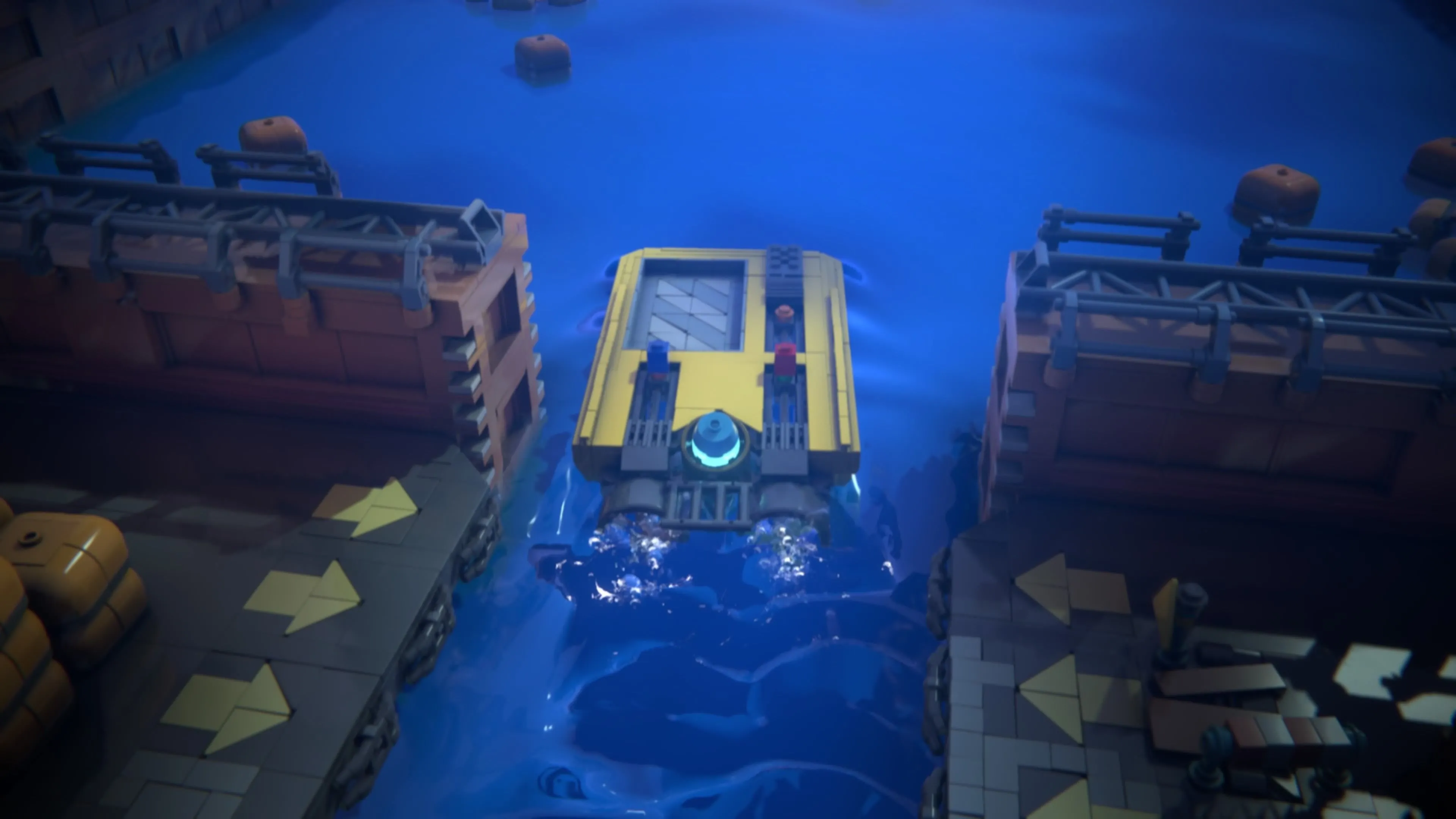Hai nhân vật LEGO Red và Blue cùng khởi động chiếc thuyền màu vàng bằng cách tương tác với các công tắc ở phía sau trong LEGO Voyagers.