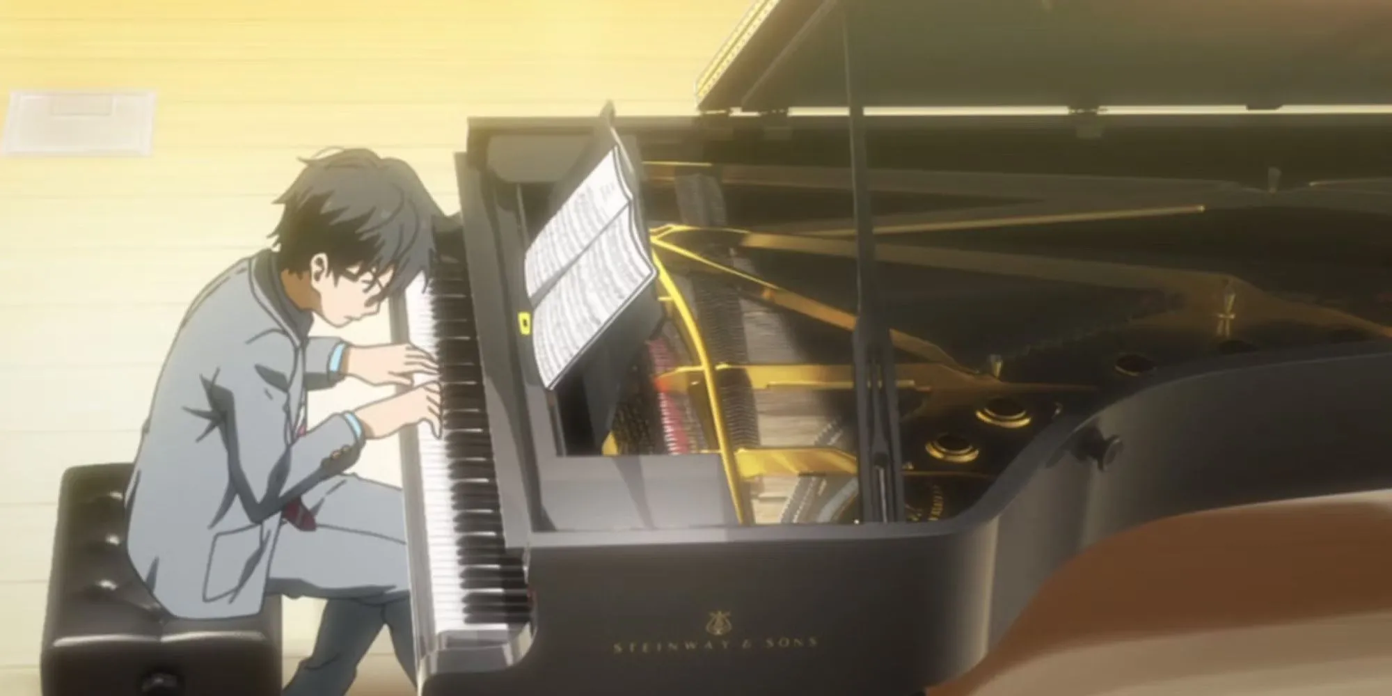 Kousei Arima biểu diễn piano trong Your Lie in April, thể hiện cuộc đấu tranh nội tâm để tìm lại âm nhạc sau bi kịch.