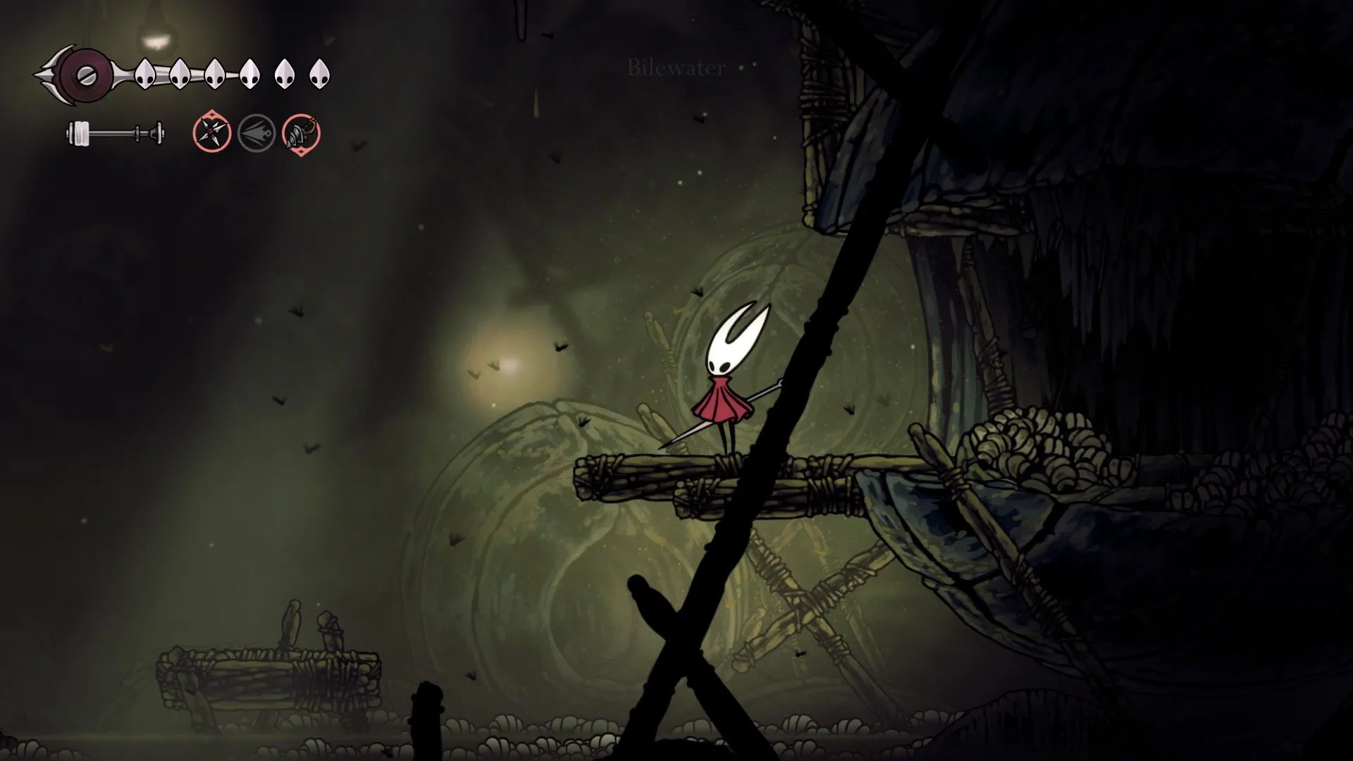 Nhân vật Groal The Great tại lối vào khu vực Bilewater trong Hollow Knight Silksong, bối cảnh đặc trưng của Pharloom